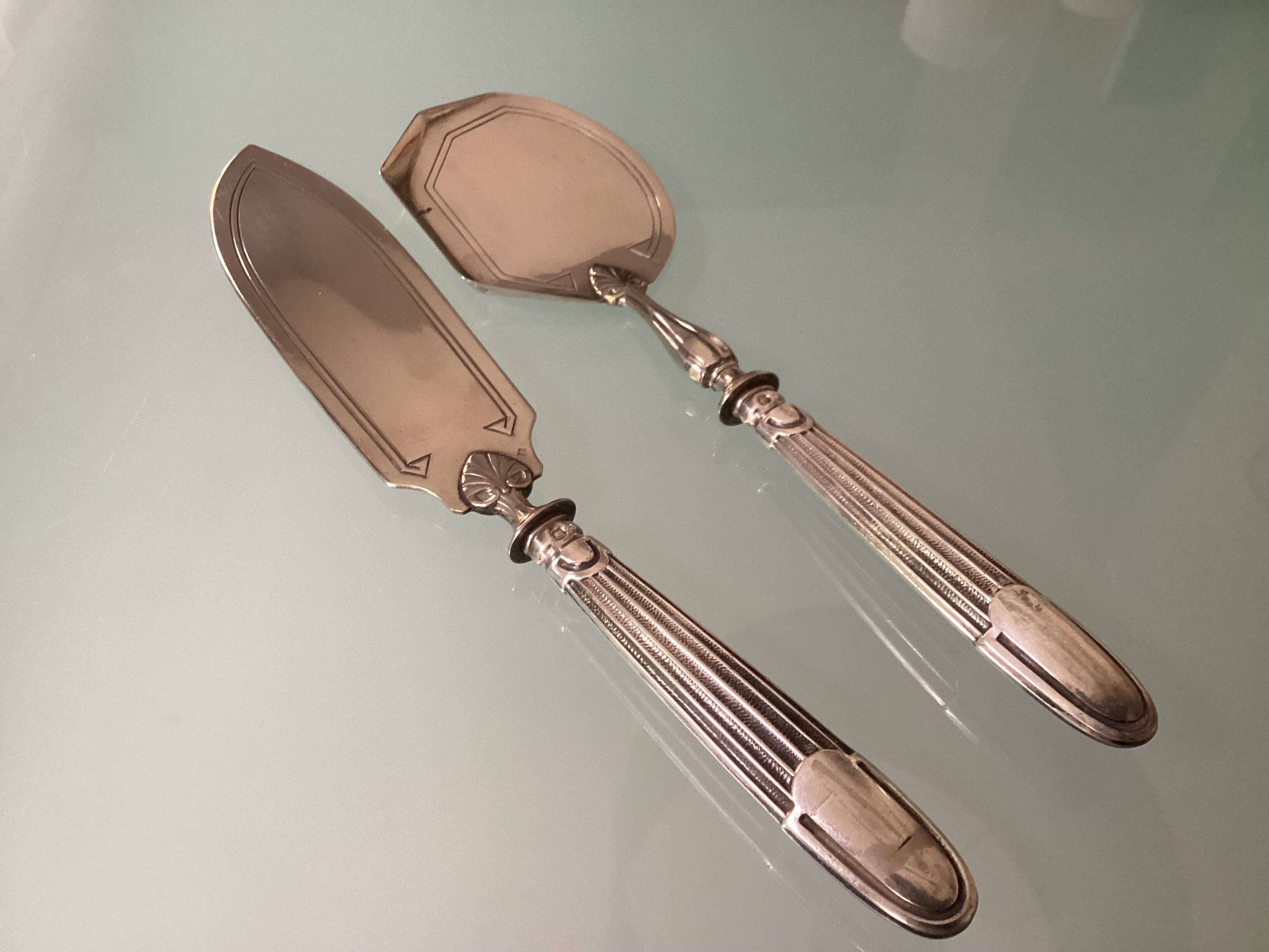 Antique silver serving cutlery with a Minerva hallmark.