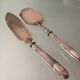 Antique silver serving cutlery with a Minerva hallmark.