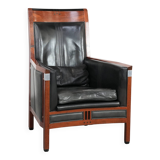 Black cowhide leather and wooden Art Deco design armchair