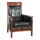 Black cowhide leather and wooden Art Deco design armchair