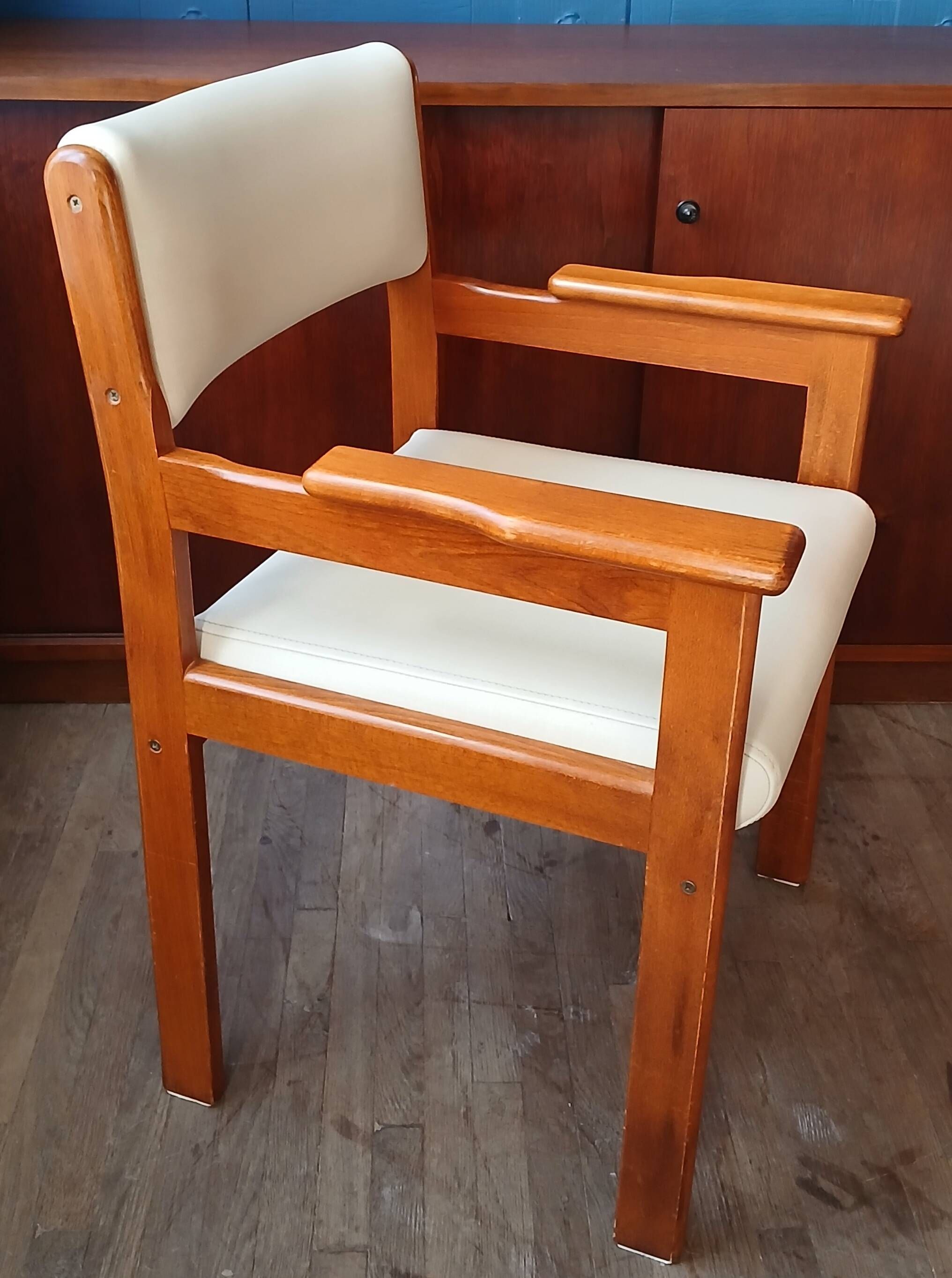 Armchair by André Sornay, stained solid beech & beige faux leather. 1980