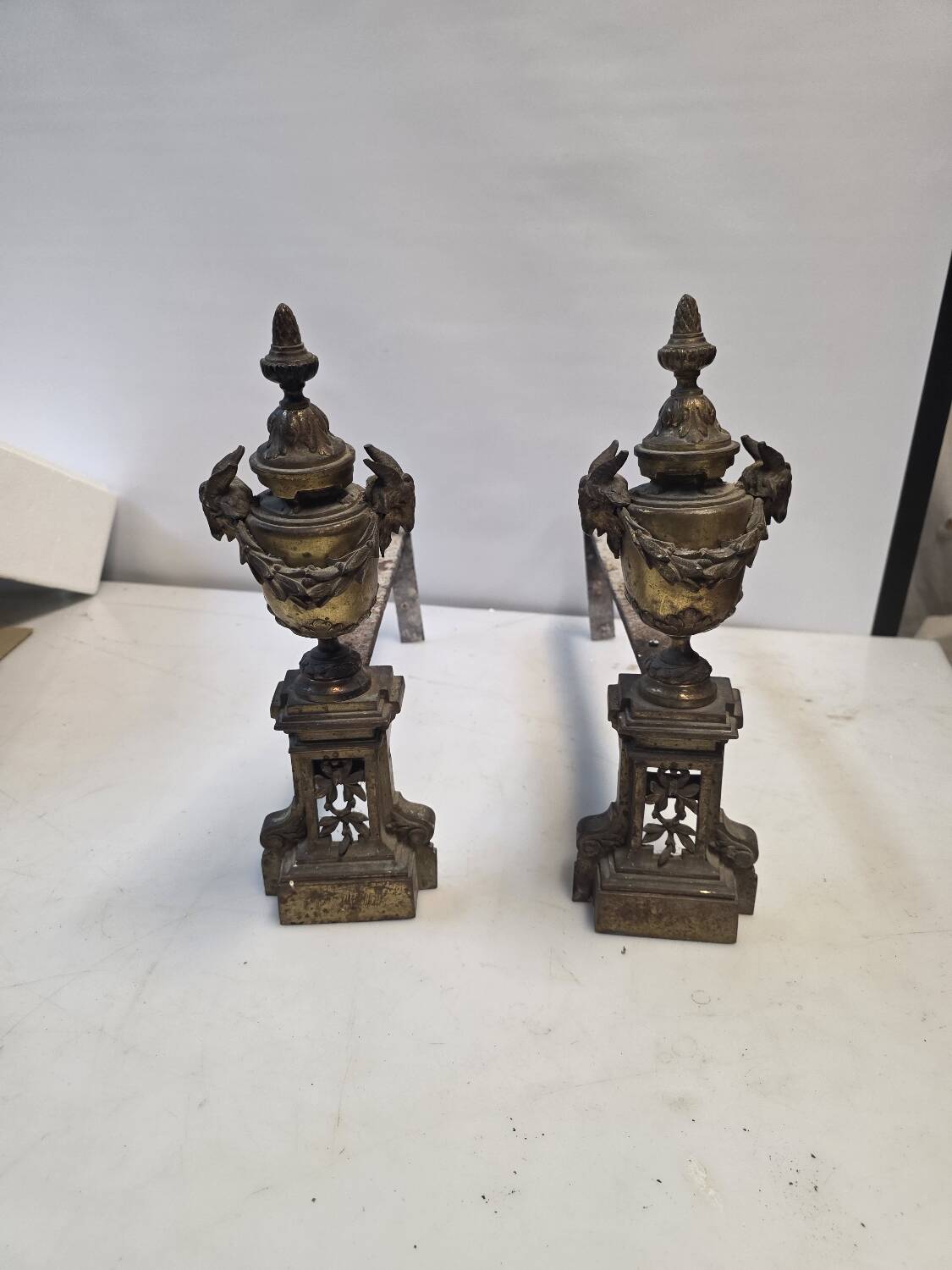 Pair of Louis XVI style andirons, 19th century in bronze