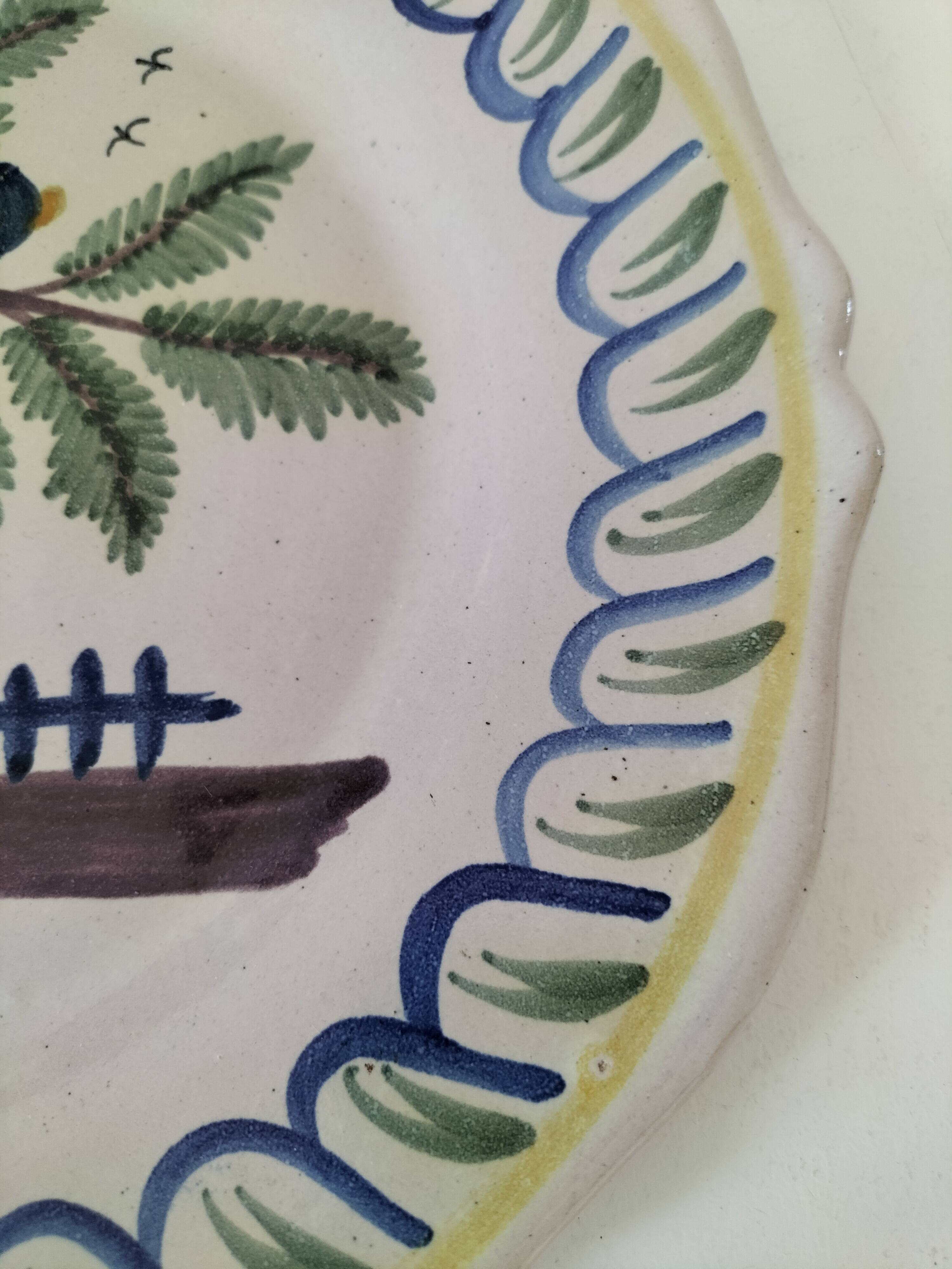 Antique hand-painted earthenware plate – piper and birds
