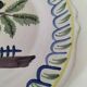 Antique hand-painted earthenware plate – piper and birds