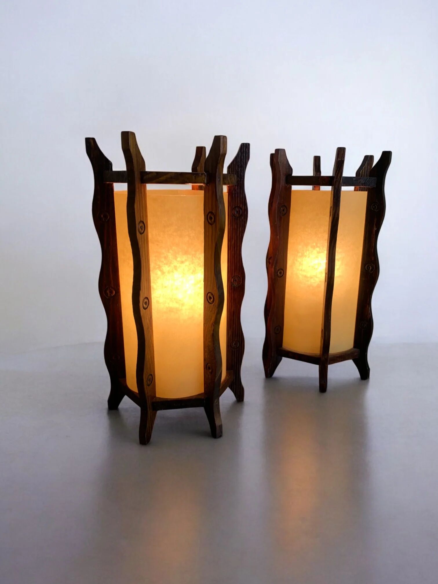 Pair of brutalist table lamps, wood & parchment, France, 1970s