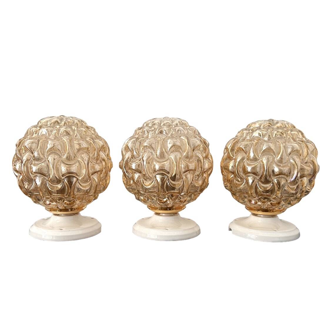 Trio of golden globe wall or ceiling lights