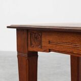 Oak Art Deco dining table with carved frieze, France 1920s