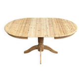 Round extendable dining table in raw solid wood, chic country style.