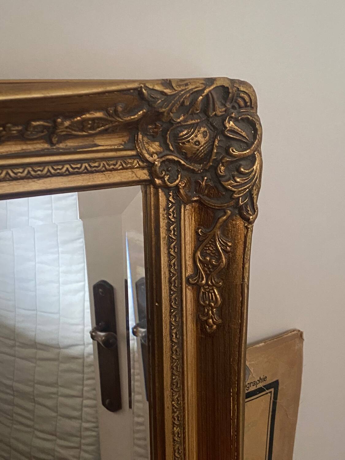 Large gilded carved wooden mirror
