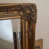 Grand miroir en bois sculpté doré