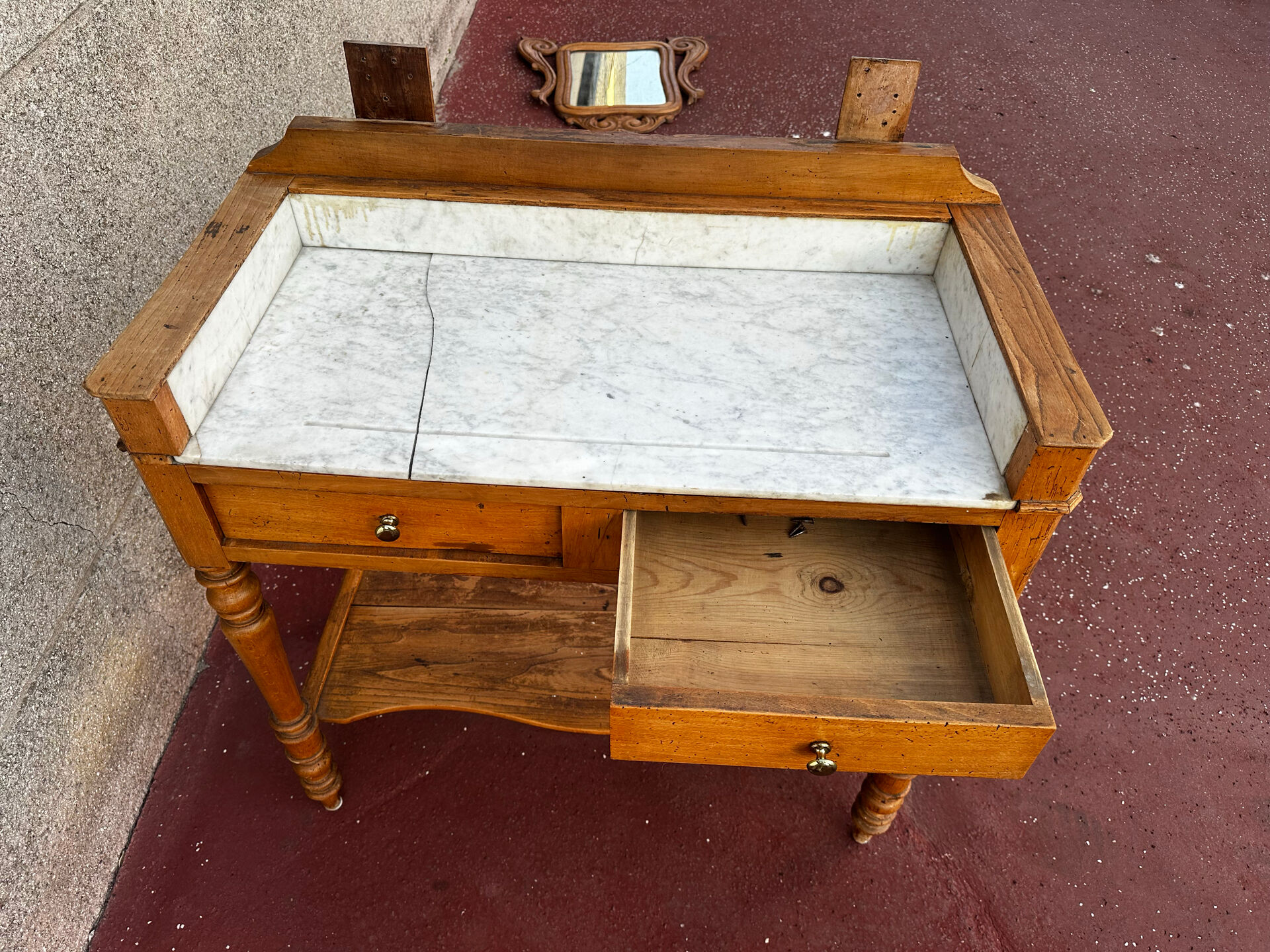 Walnut and marble dressing table, mercury mirror, circa 1850.