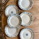 Set of 6 mismatched old iron earth flat plates