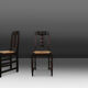 Set of six oak an wicker dining chairs by Victor Courtray
