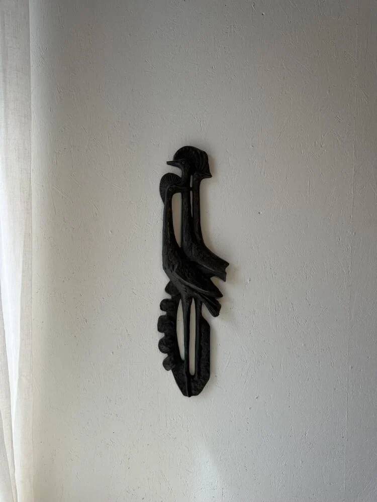 Brutalist wall sculpture with birds Ars Munda