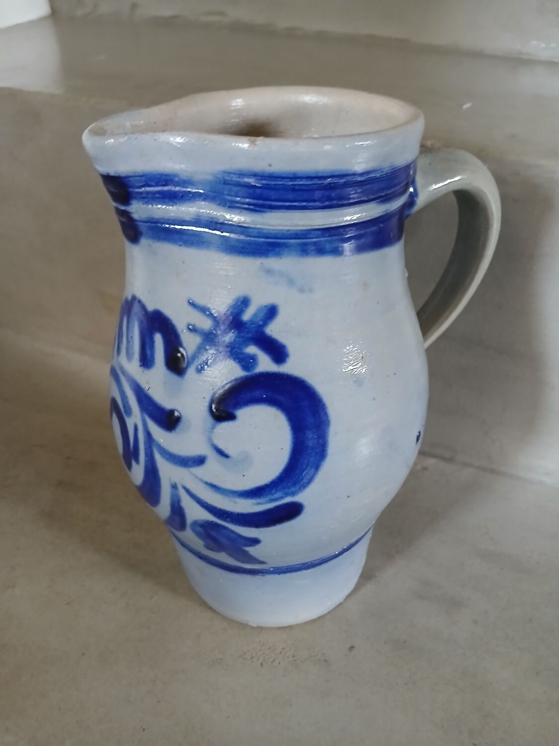 2 antique stoneware pitchers