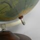 Paper mache globe on a wooden base, 1975
