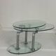 Oval designer coffee table in tempered glass