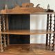 Antique wall shelf made of turned wood and spools of thread, late 19th century.