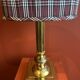 Lamp base in gilded brass, oval silk lampshade with a checkered pattern in burgundy.
