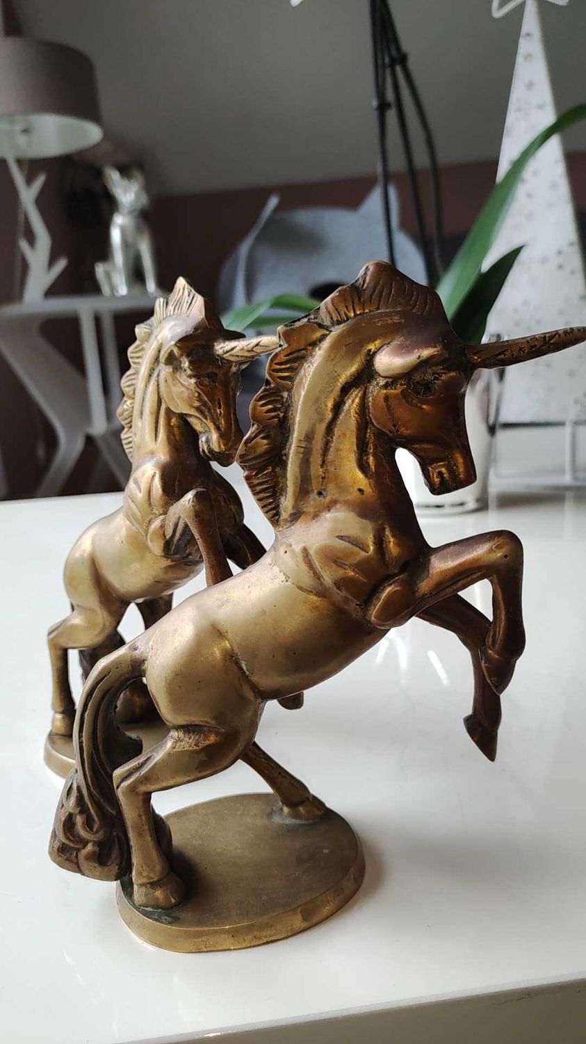 of greenhouse art deco bookends recancing unicorns. solid brass