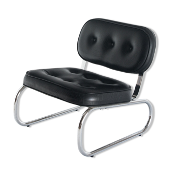 Vintage low armchair. Chrome metal and eskai - Spain, 1970s