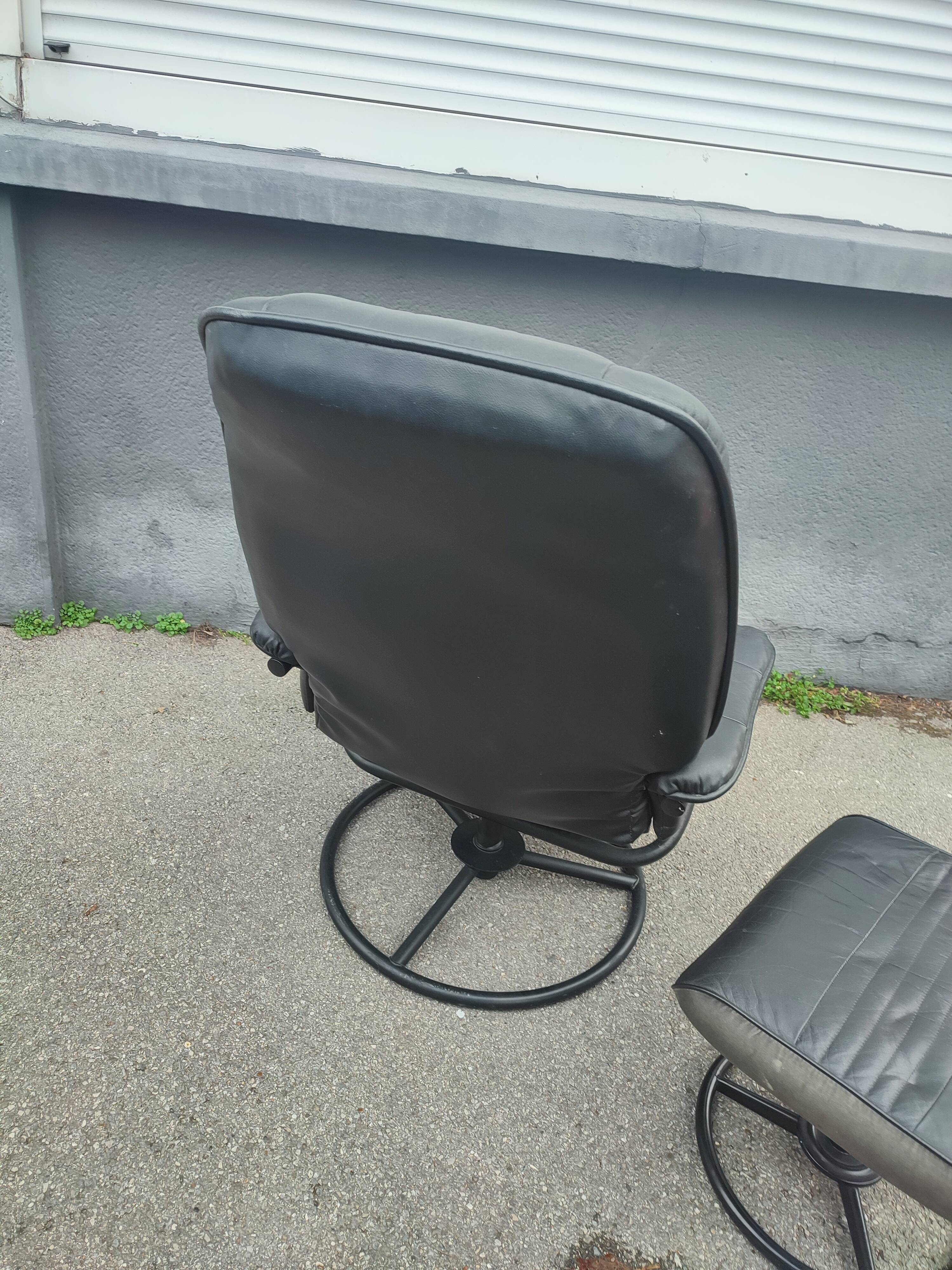 Scandinavian design leather armchair and footrest