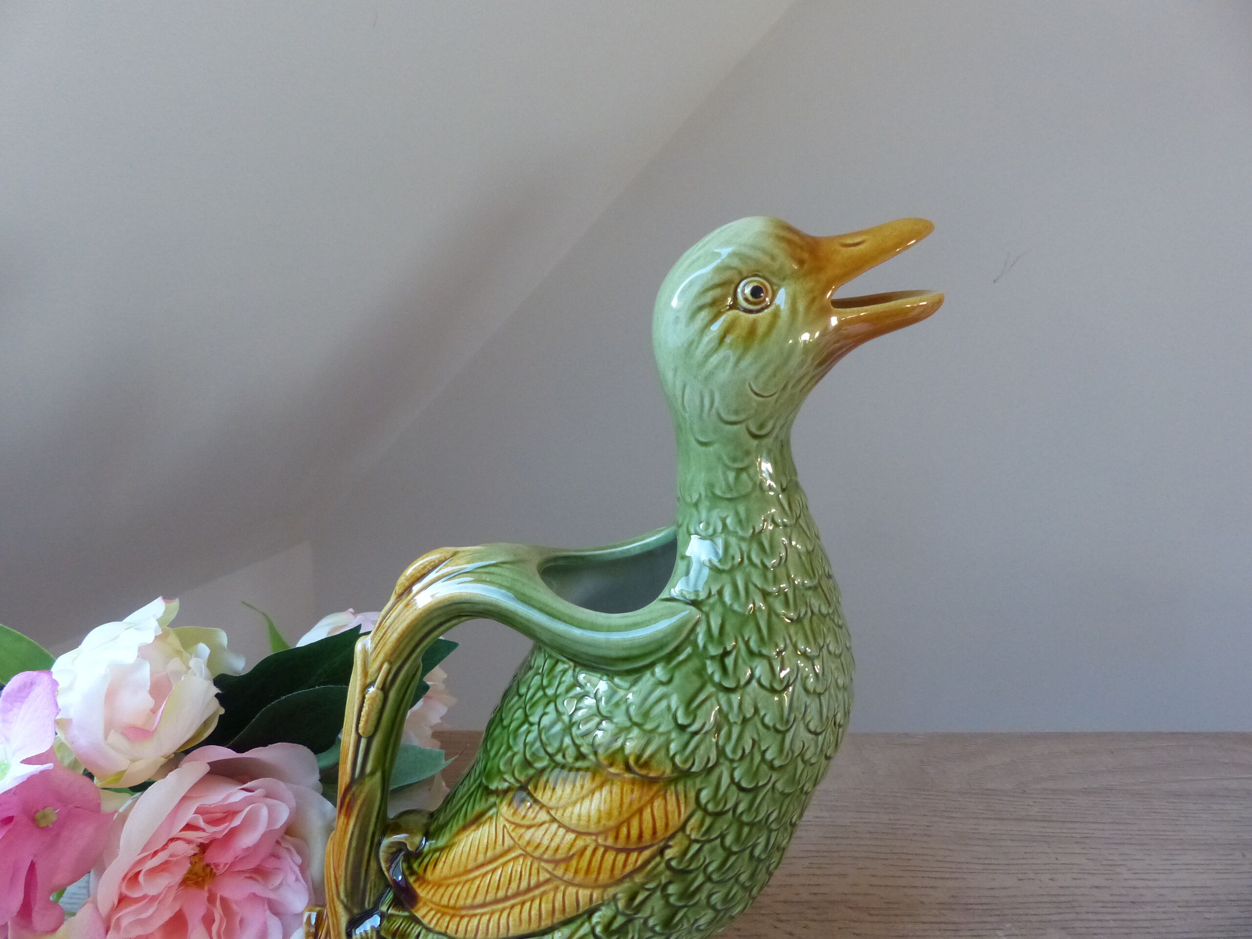 Pitcher zoomorph duck in green and yellow slip