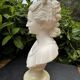 Alabaster bust of a woman signed Arnaldo Giannelli dated 1980.