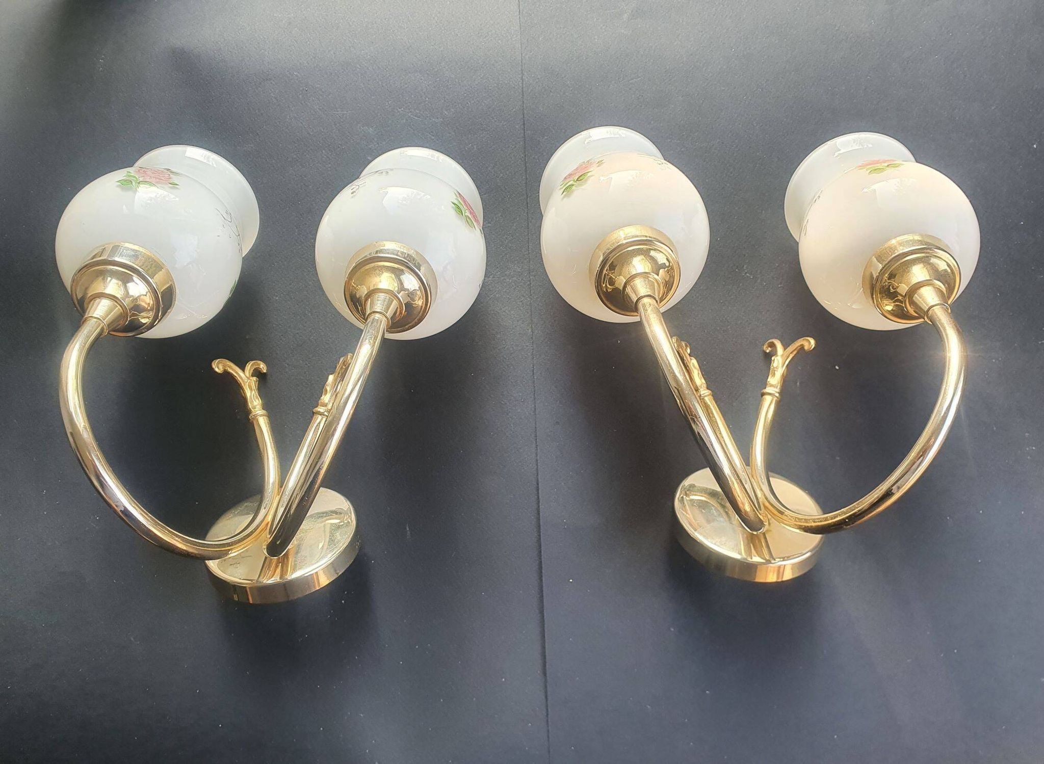 Pair of vintage wall sconces in gilded brass and pink opaline glass.