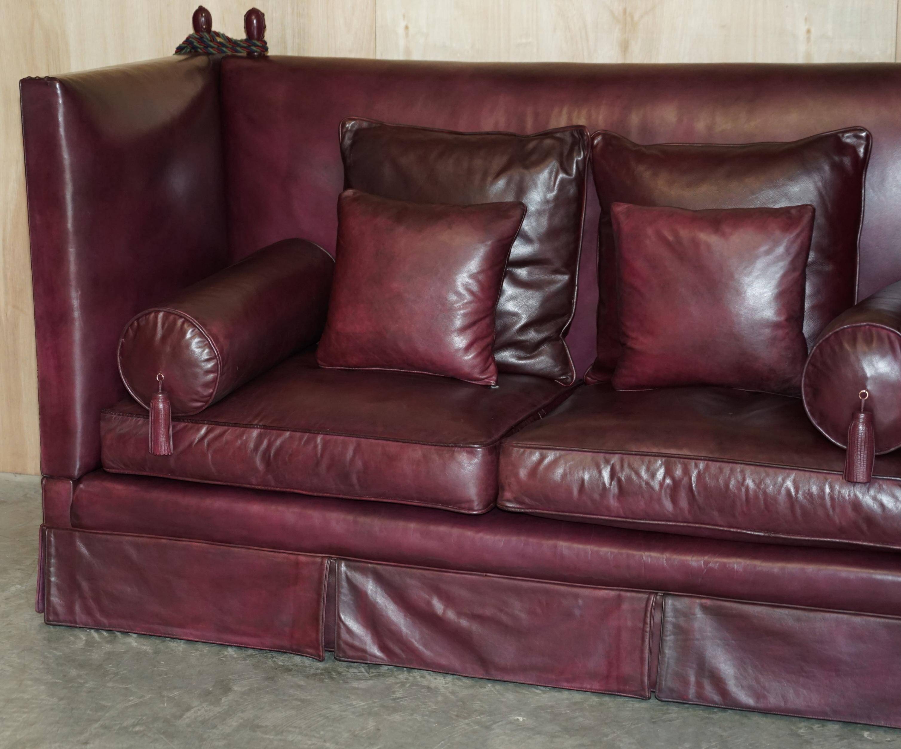 Victorian Knole canapé restored in leather with feather cushions.
