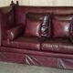Victorian Knole canapé restored in leather with feather cushions.