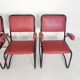 Set of 4 armchairs and a coffee table with tubular structure in Bauhaus style, 1950s.