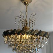 Crystal and brass chandelier with a cascade of pendants.