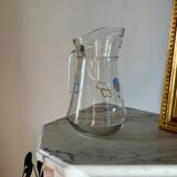 Glass pitcher with cloud decoration