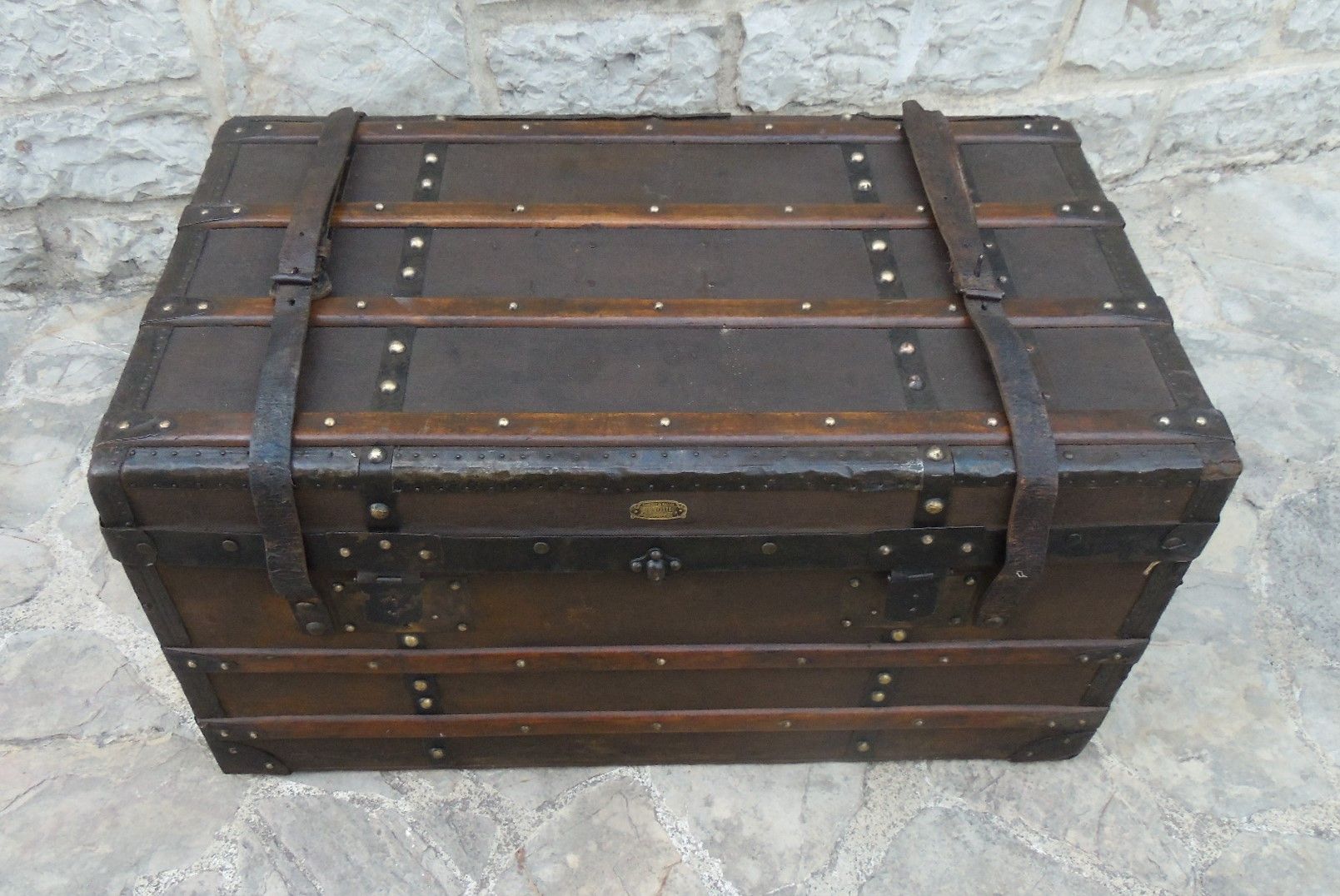 Old wooden and leather trunk, old brass nail trunk and leather strap