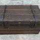 Old wooden and leather trunk, old brass nail trunk and leather strap