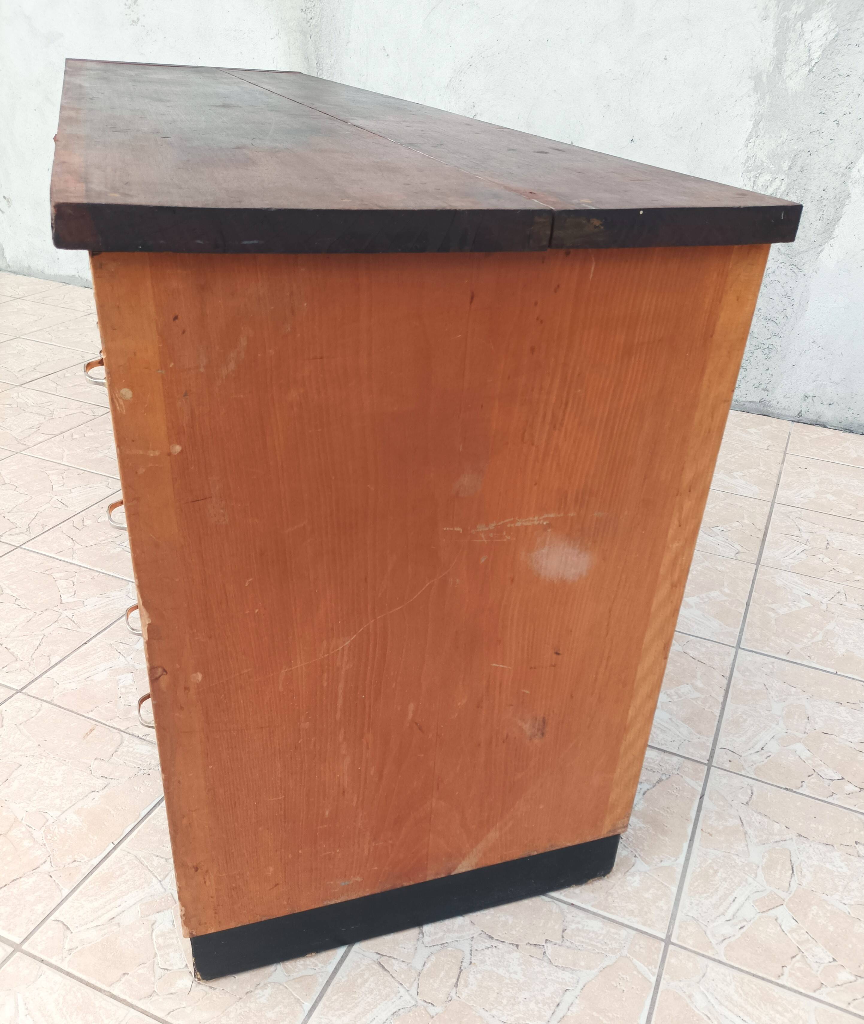 Workshop furniture with drawers and curtain in beech and walnut.