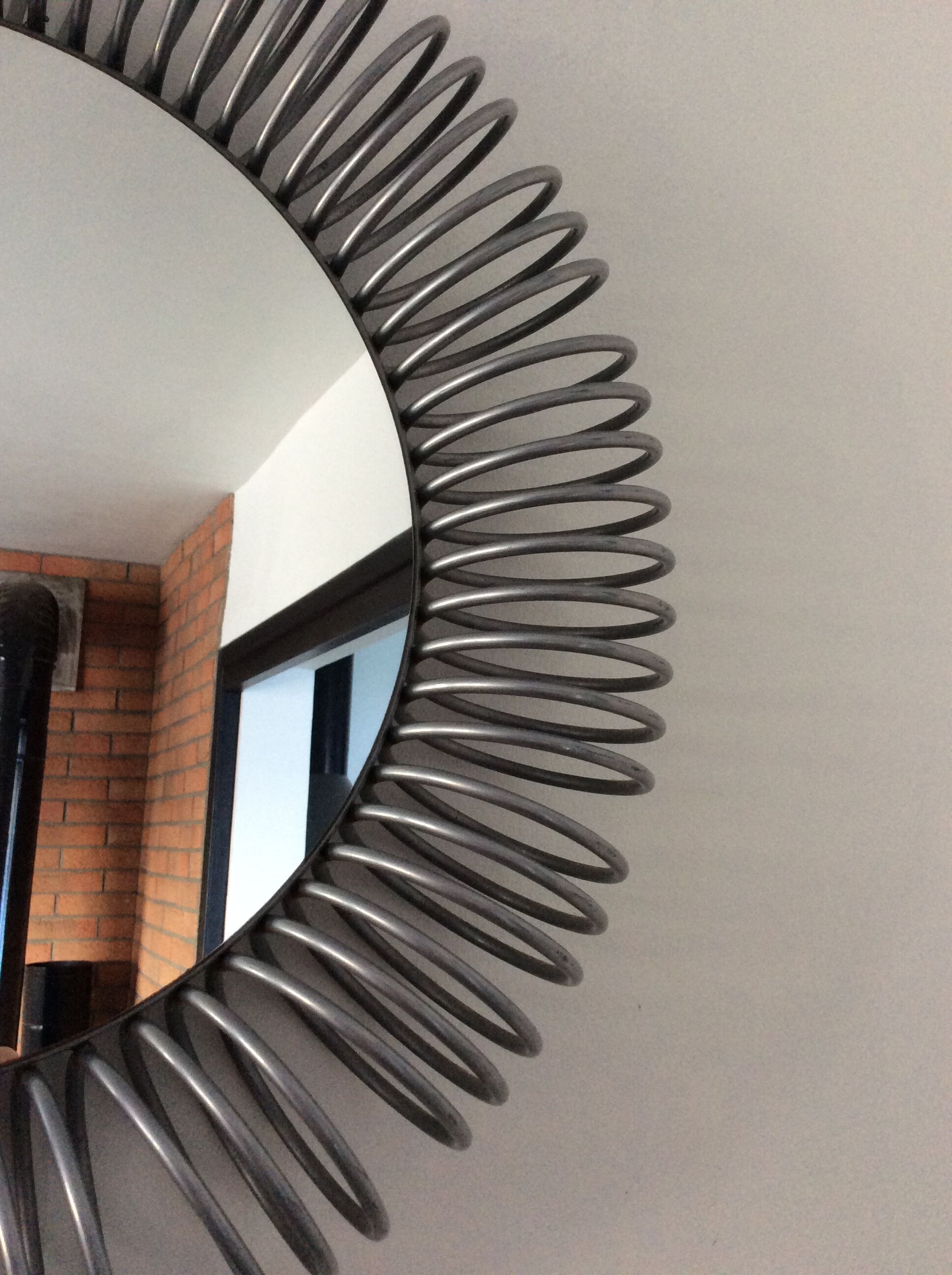 Vintage metallic spring mirror from the 70s and 80s