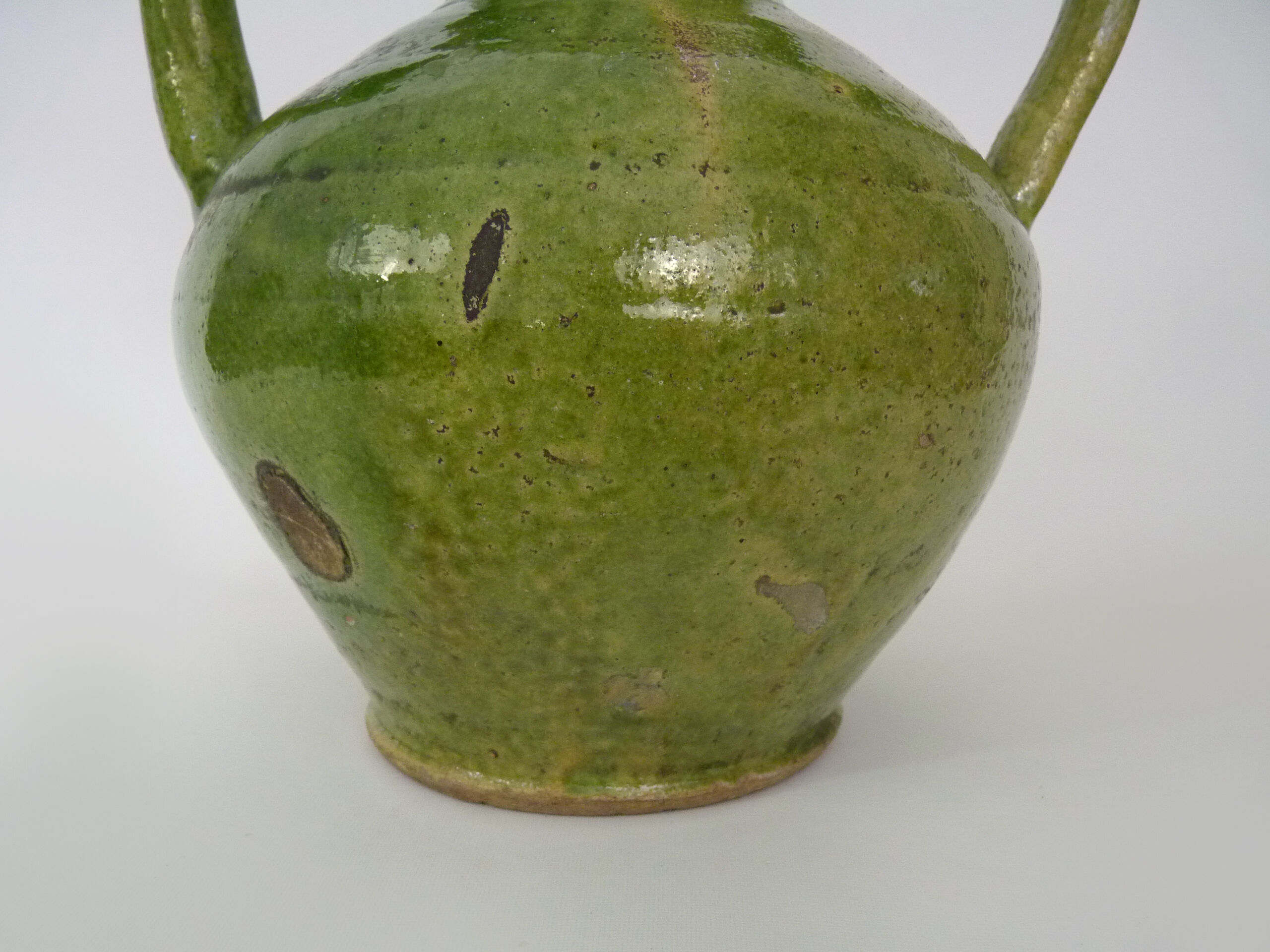 Pitcher pottery in green glazed terracotta, south west of France. XIXth