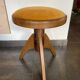 Adjustable vintage piano stool made of wood and velvet