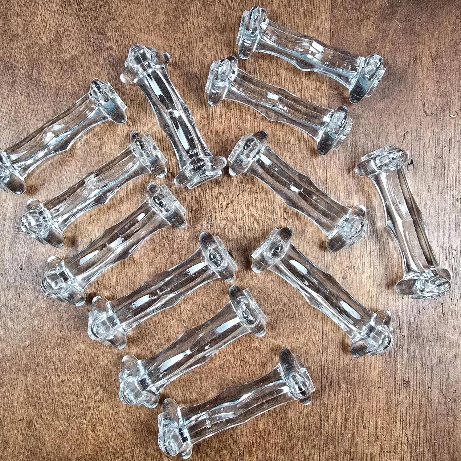 Set of 12 antique knife and fork rests in thick transparent glass.