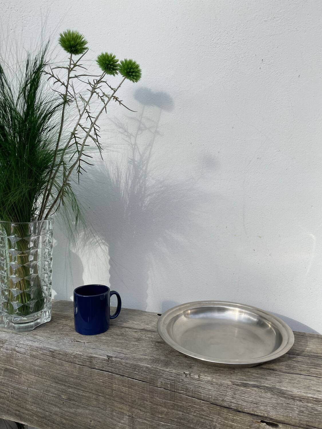 Round silver-plated metal serving dish with hallmark