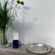 Round silver-plated metal serving dish with hallmark
