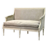 Louis XVI style canapé, in white lacquered wood.