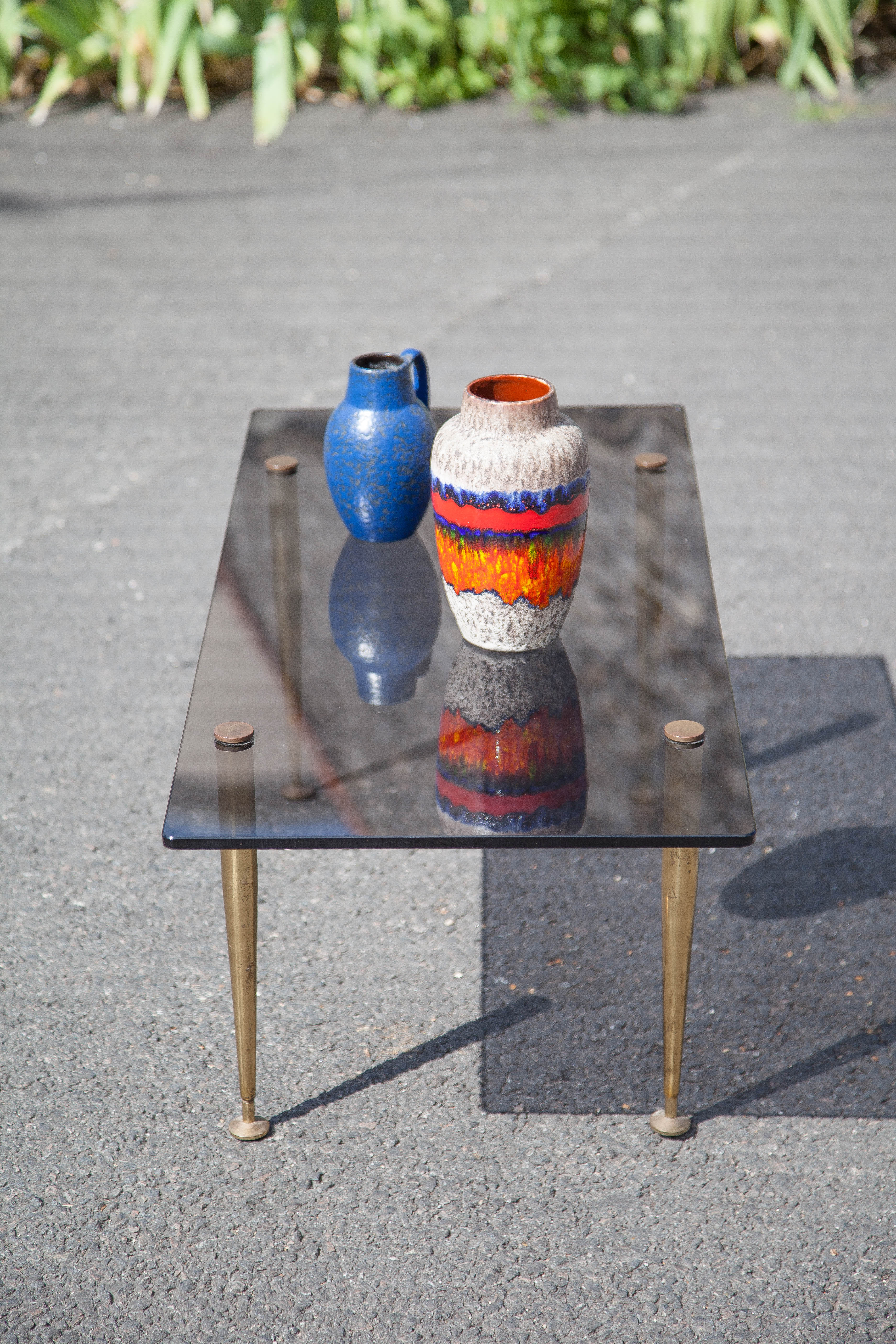 Smoked glass coffee table with adjustable brass legs, end of sofa, 70s table