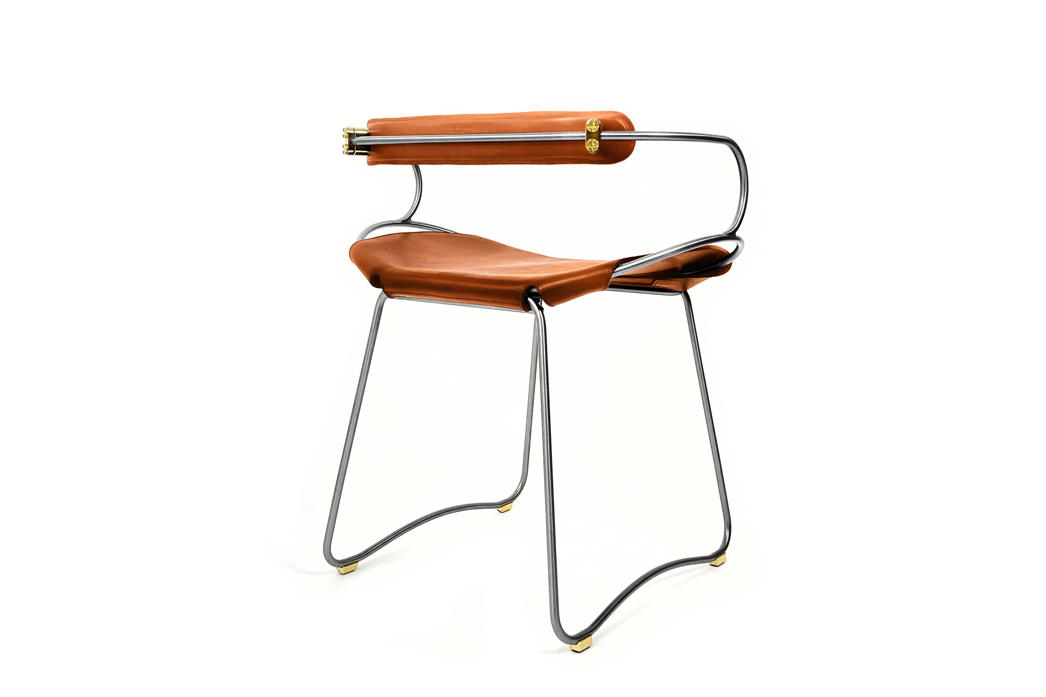 Table height stool with a backrest in aged silver metal and natural tan leather.