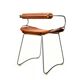 Table height stool with a backrest in aged silver metal and natural tan leather.