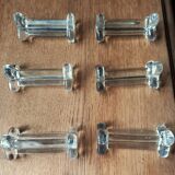 A set of 6 transparent trilobite glass knife rests.