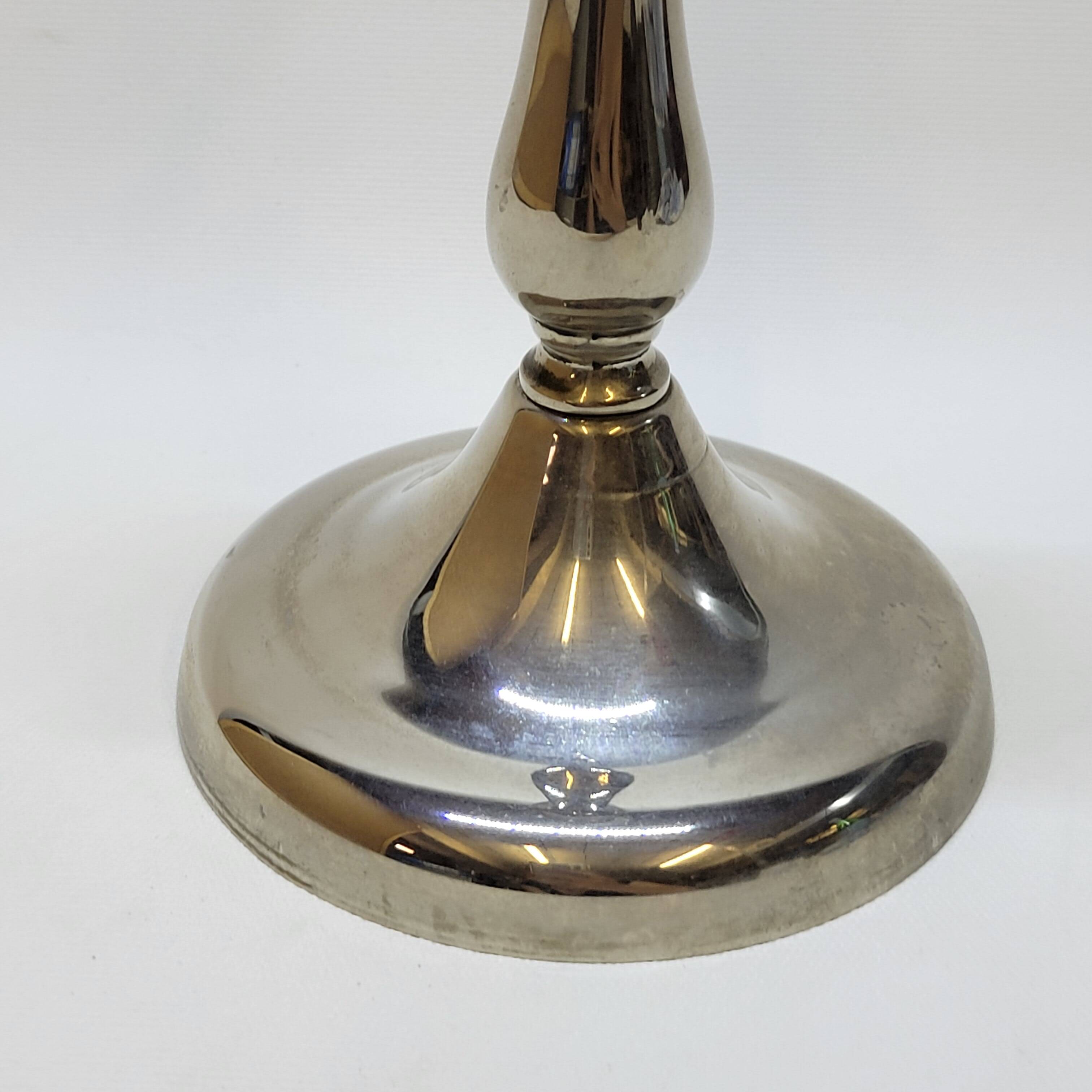 Old candle holder in silver metal