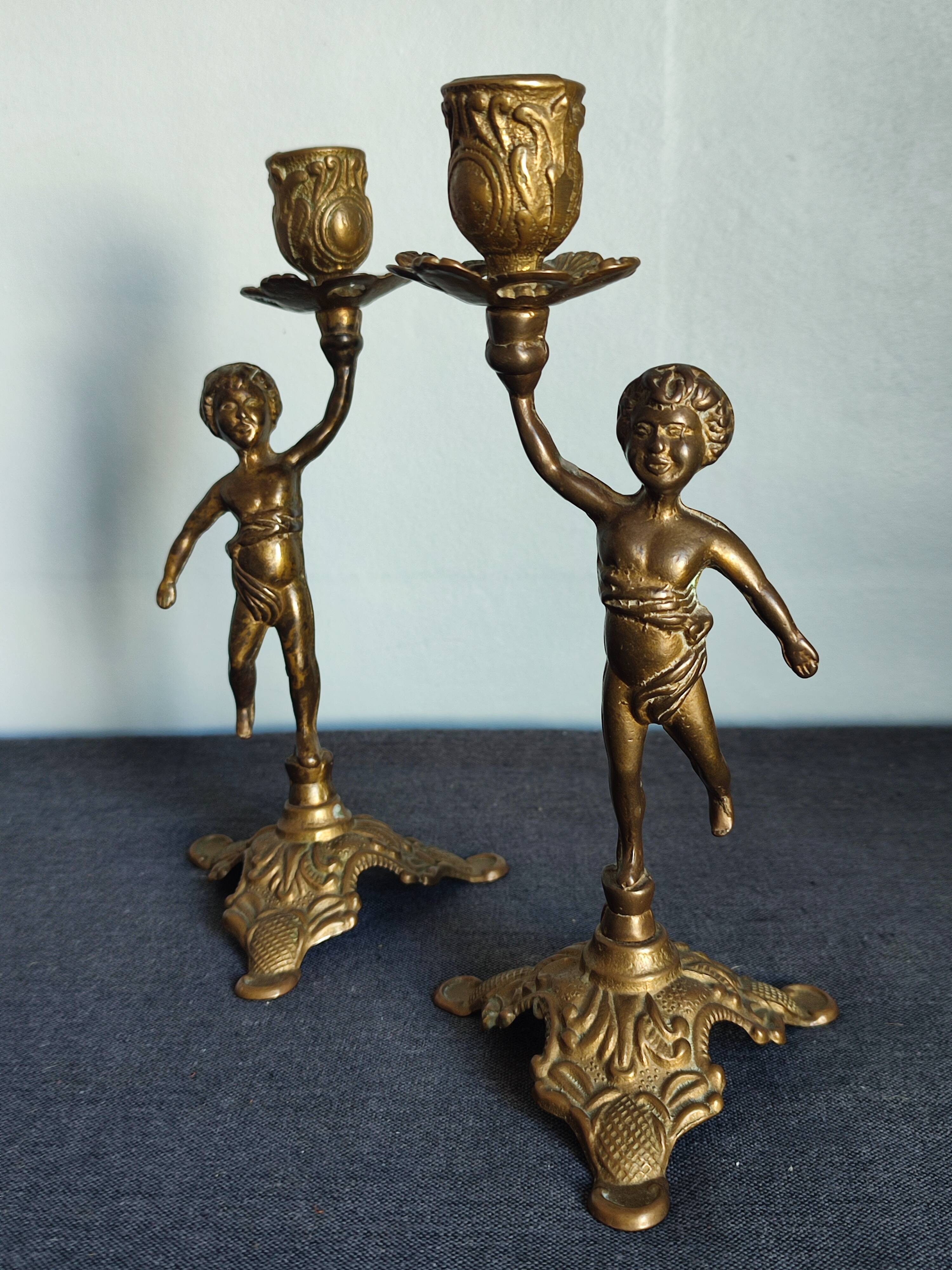 Set of two cherub cherub candlesticks